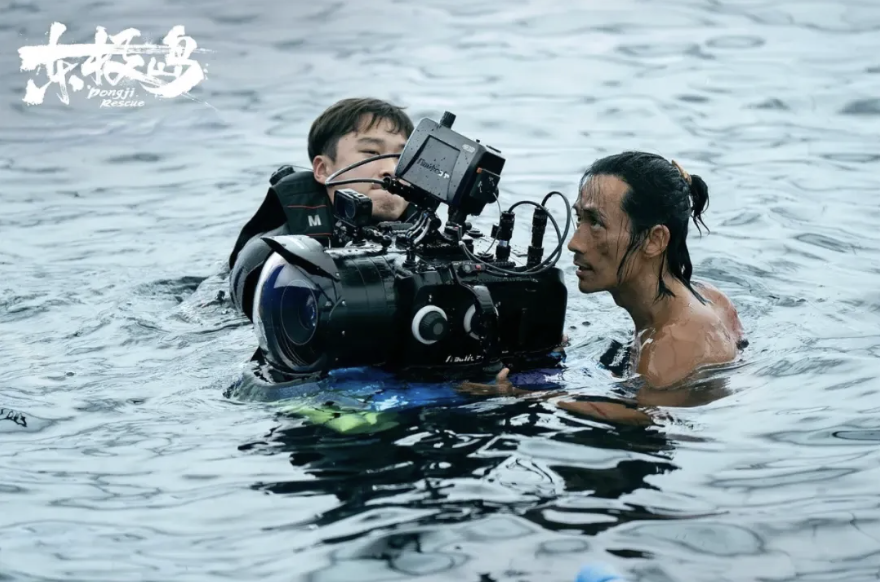 A person in a body of water with a camera
AI-generated content may be incorrect.