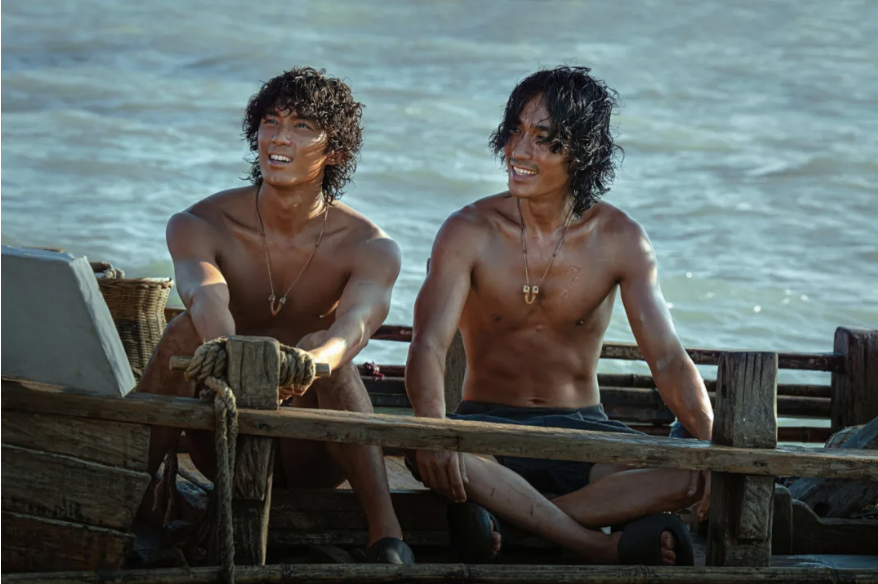 Two men sitting on a boat
AI-generated content may be incorrect.